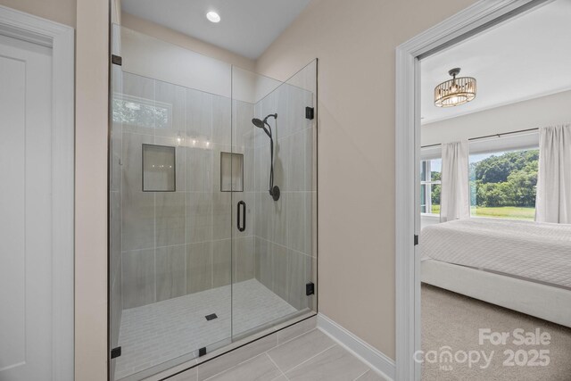 1140 Shinnville Rd, Cleveland, NC 27013 - ensuite bathroom featuring a stall shower, tile patterned flooring, recessed lighting, and a chandelier