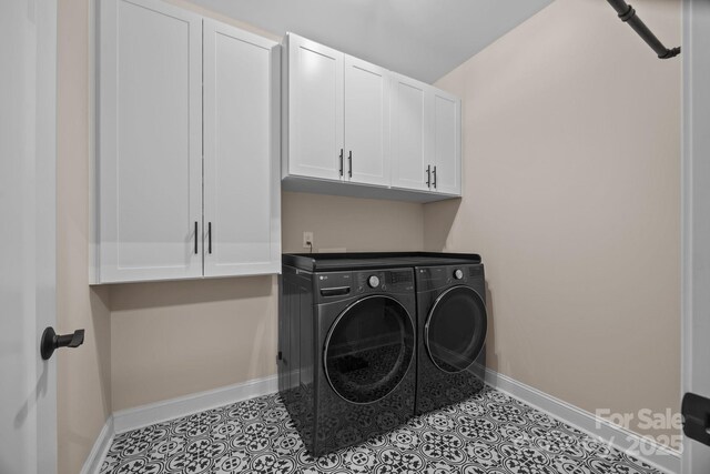 1140 Shinnville Rd, Cleveland, NC 27013 - laundry area with washing machine and dryer, cabinet space, and tile patterned floors