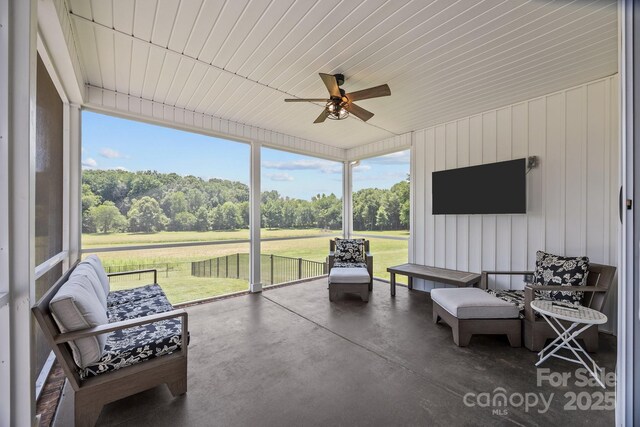 1140 Shinnville Rd, Cleveland, NC 27013 - sunroom / solarium with ceiling fan, plenty of natural light, and view of wooded area