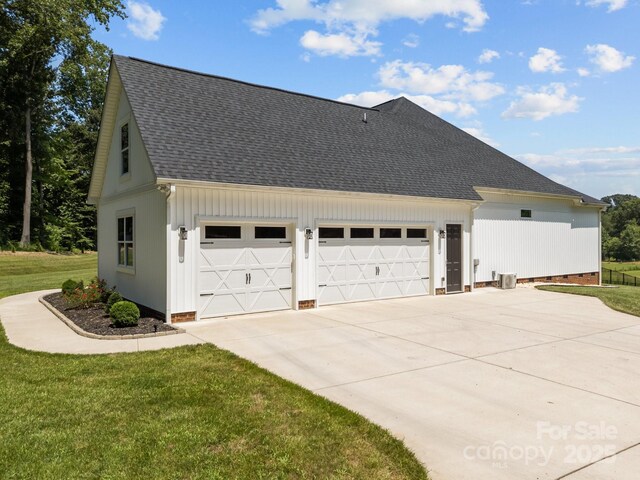 1140 Shinnville Rd, Cleveland, NC 27013 - view of property exterior with roof with shingles, concrete driveway, crawl space, board and batten siding, and a garage