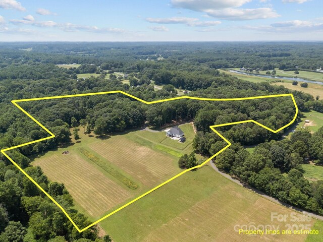 1140 Shinnville Rd, Cleveland, NC 27013 - overview of rural landscape featuring property boundaries highlighted and a heavily wooded area
