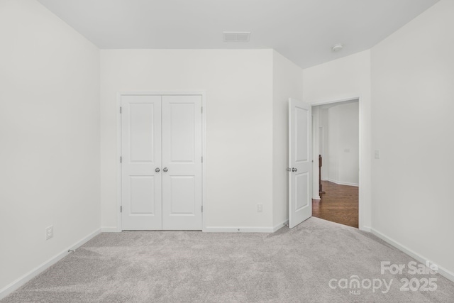 17203 Summers Walk Blvd, Davidson, NC 28036 - unfurnished bedroom featuring carpet floors and a closet
