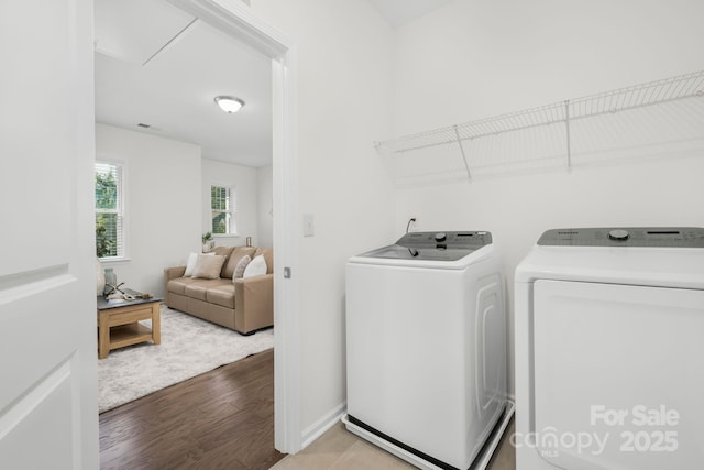 17203 Summers Walk Blvd, Davidson, NC 28036 - laundry room featuring washing machine and clothes dryer and wood finished floors