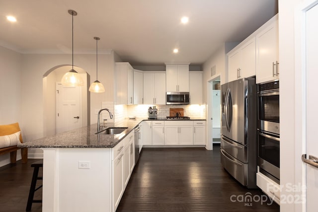 5907 Barrowlands Ct, Charlotte, NC 28210 - kitchen featuring stainless steel appliances, a peninsula, recessed lighting, white cabinetry, and decorative backsplash