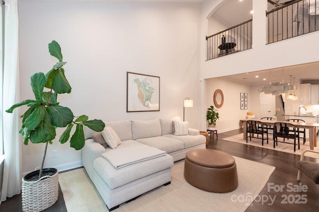 5907 Barrowlands Ct, Charlotte, NC 28210 - living area featuring wood finished floors and a high ceiling