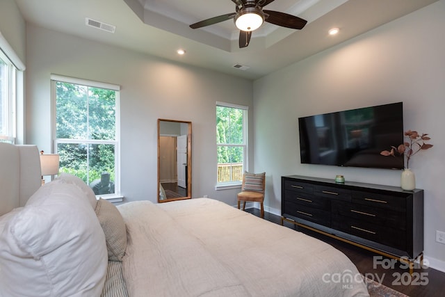 5907 Barrowlands Ct, Charlotte, NC 28210 - bedroom with a tray ceiling, recessed lighting, wood finished floors, and a ceiling fan