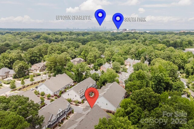 5907 Barrowlands Ct, Charlotte, NC 28210 - aerial perspective of suburban area with a heavily wooded area