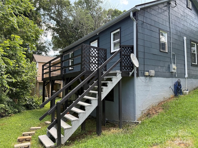 703 Stage St NW, Lenoir, NC 28645 - view of home's exterior featuring a wooden deck, a lawn, and stairway