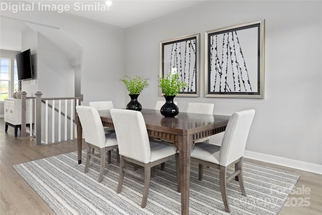 1348 Holden Ave SW, Concord, NC 28025 - dining area featuring light wood-style flooring and baseboards