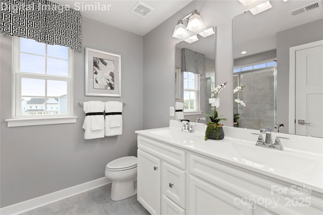 1348 Holden Ave SW, Concord, NC 28025 - bathroom featuring double vanity, tiled shower, and tile patterned floors