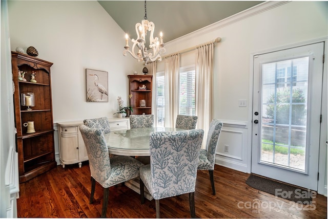 2218 Wednesbury Ct, Kannapolis, NC 28083 - dining area featuring a chandelier, dark wood finished floors, wainscoting, ornamental molding, and lofted ceiling