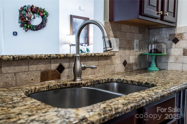 2218 Wednesbury Ct, Kannapolis, NC 28083 - kitchen view of dark stone counters, backsplash, and dark brown cabinets