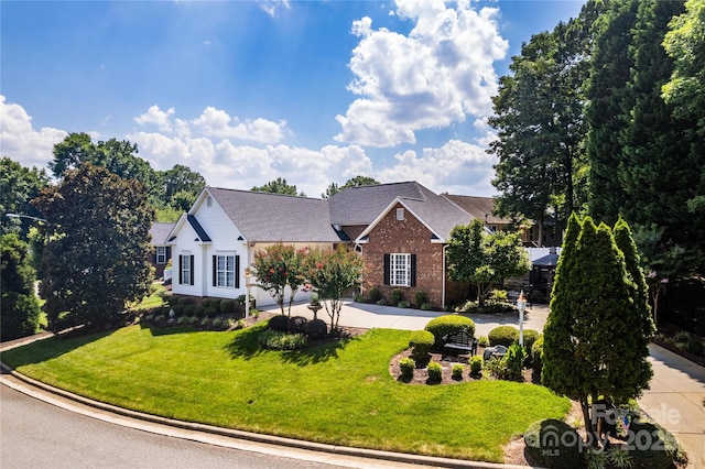 2218 Wednesbury Ct, Kannapolis, NC 28083 - traditional-style house with brick siding, a front lawn, and roof with shingles
