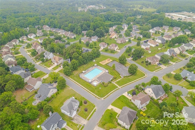 9910 Sandman Ln, Charlotte, NC 28216 - aerial perspective of suburban area with a pool