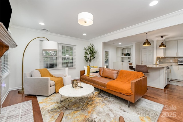 3106 Windstream Ct, Charlotte, NC 28210 - living room with ornamental molding, light wood-style floors, and recessed lighting