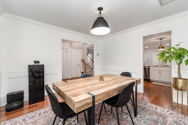 3106 Windstream Ct, Charlotte, NC 28210 - dining space featuring hardwood / wood-style floors, crown molding, stairs, a wainscoted wall, and a decorative wall