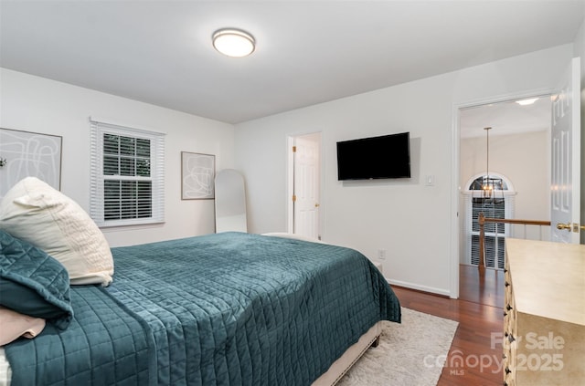 3106 Windstream Ct, Charlotte, NC 28210 - bedroom featuring dark wood-type flooring and a chandelier