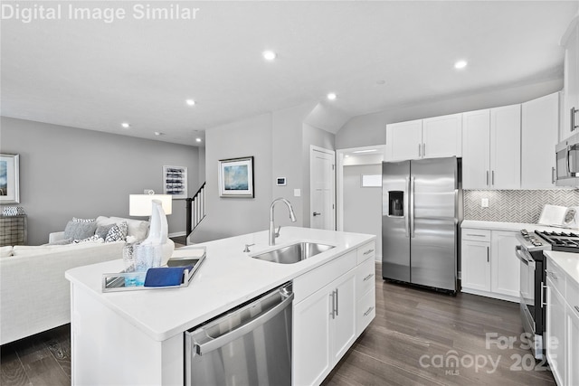7319 Childress Dr SW, Concord, NC 28025 - kitchen featuring stainless steel appliances, an island with sink, open floor plan, recessed lighting, and dark wood-type flooring