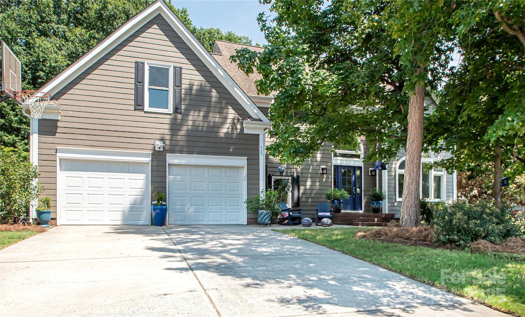 10711 Spring Camp Way, Charlotte, NC 28277 - view of front facade featuring driveway and a garage