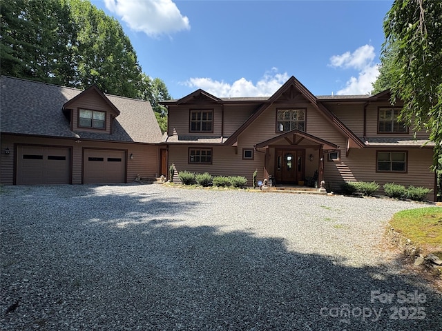 266 Lost Mine Trl Unit 602, Brevard, NC 28712 - view of front of home with driveway, an attached garage, and roof with shingles