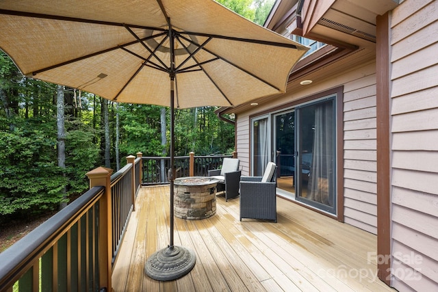 266 Lost Mine Trl Unit 602, Brevard, NC 28712 - wooden terrace with a fire pit and view of scattered trees