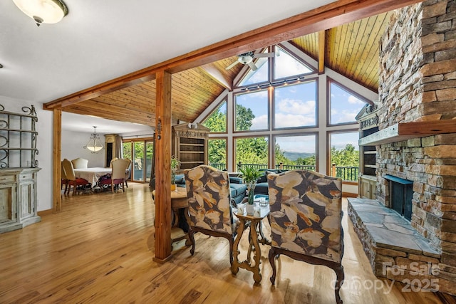 266 Lost Mine Trl Unit 602, Brevard, NC 28712 - living area featuring a fireplace, light wood-style floors, high vaulted ceiling, a wood ceiling with exposed beams, and ceiling fan