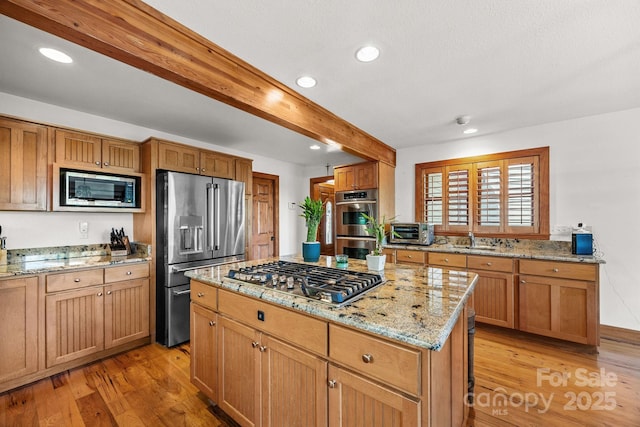 266 Lost Mine Trl Unit 602, Brevard, NC 28712 - kitchen featuring stainless steel appliances, beamed ceiling, light wood-type flooring, light stone counters, and recessed lighting