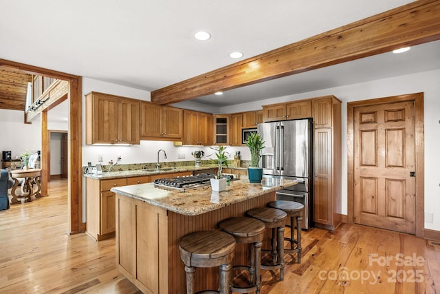 266 Lost Mine Trl Unit 602, Brevard, NC 28712 - kitchen with recessed lighting, beam ceiling, stainless steel appliances, light wood-style floors, and light stone countertops