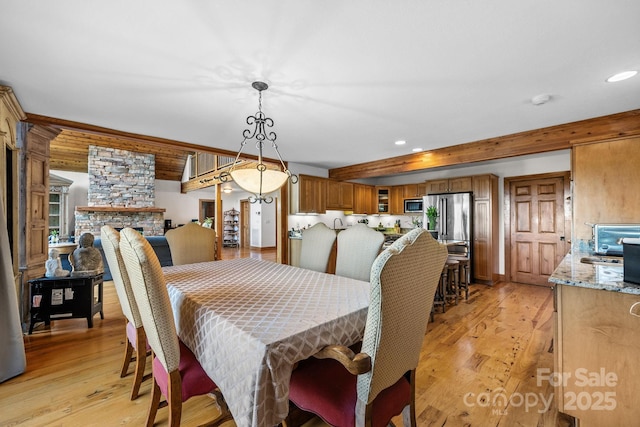 266 Lost Mine Trl Unit 602, Brevard, NC 28712 - dining space with light wood-type flooring, recessed lighting, and a stone fireplace
