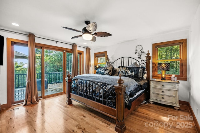266 Lost Mine Trl Unit 602, Brevard, NC 28712 - bedroom with access to exterior, multiple windows, wood finished floors, a ceiling fan, and recessed lighting