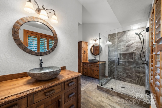 266 Lost Mine Trl Unit 602, Brevard, NC 28712 - bathroom with a stall shower, two vanities, and a textured wall