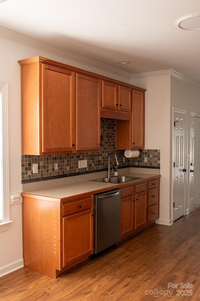 4500 Sages Ave, Indian Trail, NC 28079 - kitchen featuring dishwasher, decorative backsplash, crown molding, wood finished floors, and brown cabinetry