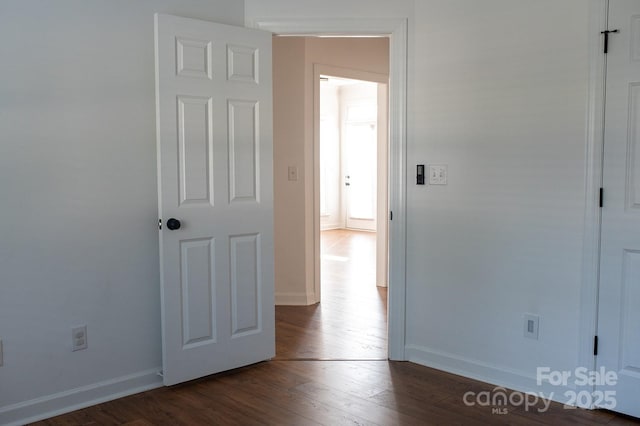 4500 Sages Ave, Indian Trail, NC 28079 - unfurnished bedroom featuring dark wood-style floors and baseboards