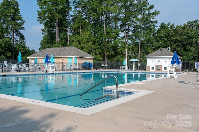 4500 Sages Ave, Indian Trail, NC 28079 - community pool featuring a patio and view of wooded area