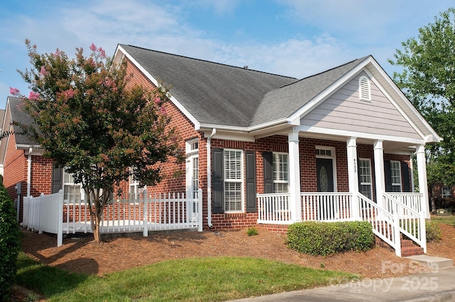 4500 Sages Ave, Indian Trail, NC 28079 - view of front of house with brick siding, roof with shingles, and a porch