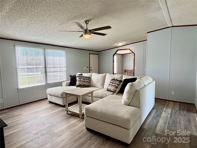 2268 Arrowwood Dr, Hickory, NC 28601 - living area featuring a ceiling fan, wood finished floors, crown molding, lofted ceiling, and a textured ceiling