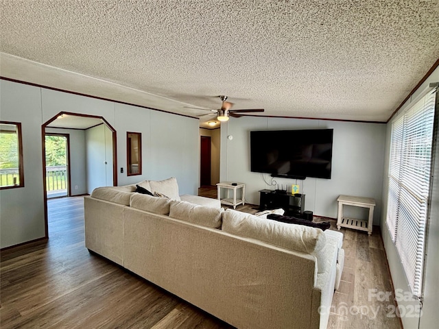 2268 Arrowwood Dr, Hickory, NC 28601 - living area with arched walkways, wood finished floors, a textured ceiling, and a ceiling fan