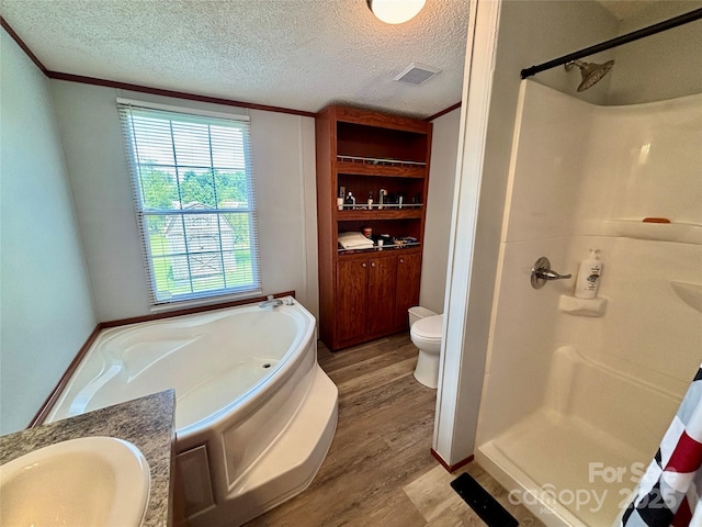 2268 Arrowwood Dr, Hickory, NC 28601 - bathroom featuring wood finished floors, a bath, a shower, a textured ceiling, and vanity