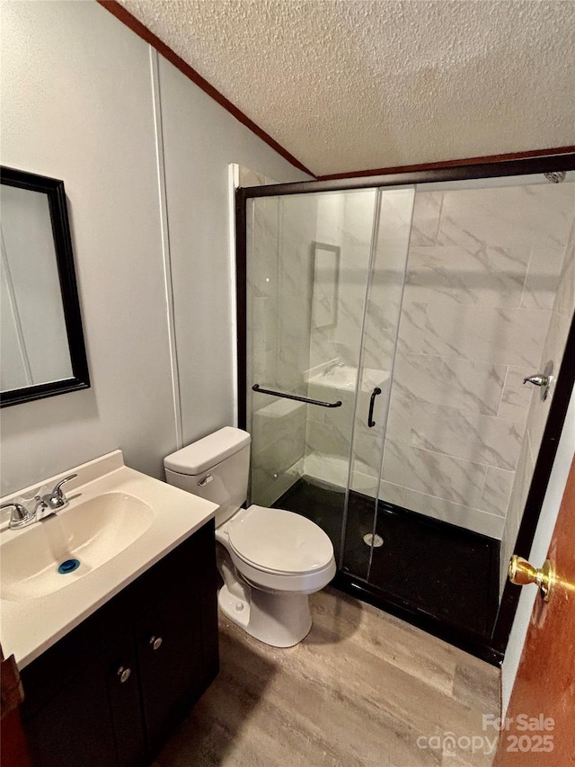 2268 Arrowwood Dr, Hickory, NC 28601 - full bath featuring vanity, wood finished floors, a stall shower, a textured ceiling, and ornamental molding