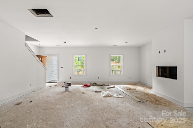 4641 Yellow Poplar Ln, Concord, NC 28025 - unfurnished living room with baseboards and stairs