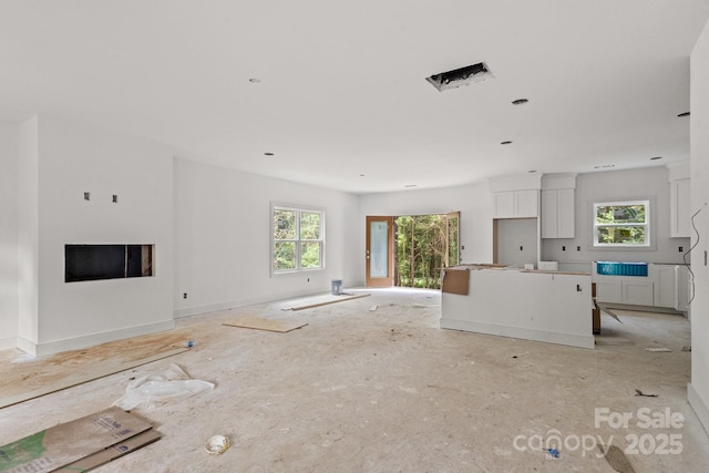 4641 Yellow Poplar Ln, Concord, NC 28025 - unfurnished living room featuring healthy amount of natural light