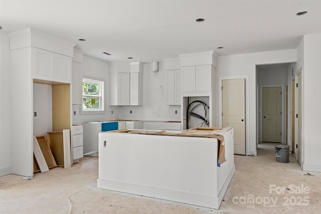 4641 Yellow Poplar Ln, Concord, NC 28025 - kitchen with a kitchen island and white cabinets