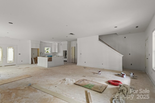 4641 Yellow Poplar Ln, Concord, NC 28025 - unfurnished living room with stairs and washer / clothes dryer