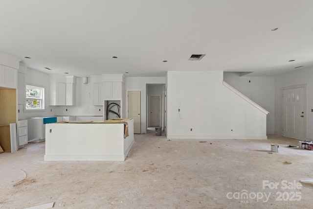4641 Yellow Poplar Ln, Concord, NC 28025 - kitchen with a center island, white cabinets, and open floor plan