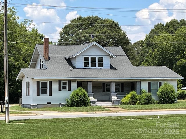 509 E Grover St, Shelby, NC 28150 - view of front of home with a chimney, covered porch, a front lawn, and a shingled roof