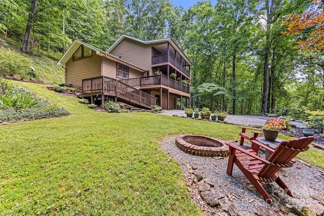 747 Bear Cove Cir, Bryson City, NC 28713 - back of house with an outdoor fire pit, a lawn, a balcony, and a deck