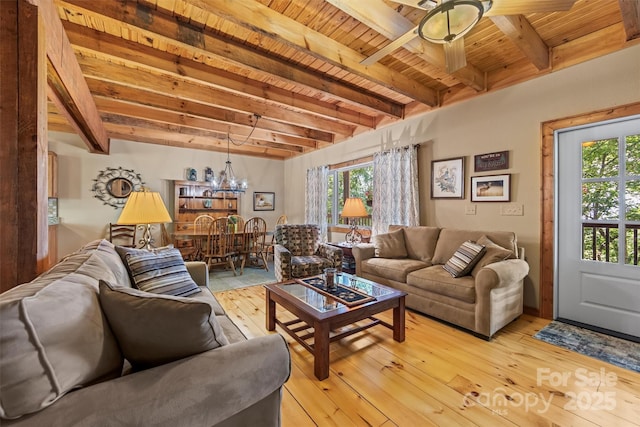 747 Bear Cove Cir, Bryson City, NC 28713 - living area featuring light wood finished floors, a wooden ceiling with exposed beams, a ceiling fan, and a chandelier