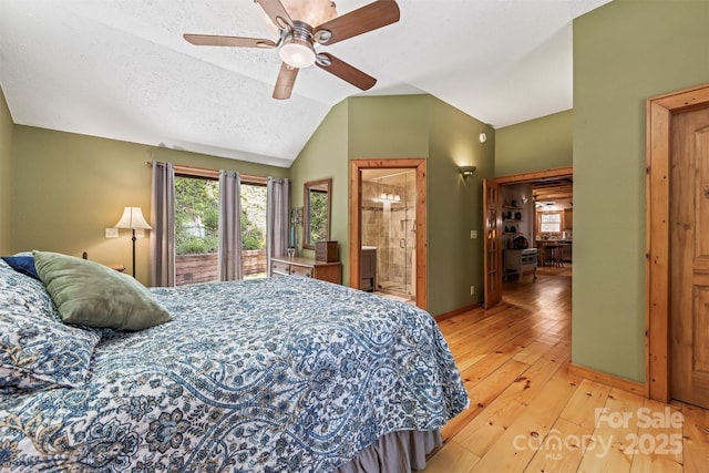 747 Bear Cove Cir, Bryson City, NC 28713 - bedroom with light wood-style floors, vaulted ceiling, connected bathroom, and ceiling fan