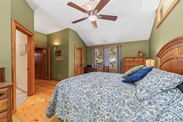 747 Bear Cove Cir, Bryson City, NC 28713 - bedroom featuring light wood-style flooring, lofted ceiling, and ceiling fan