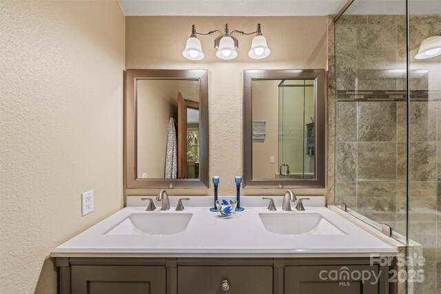 747 Bear Cove Cir, Bryson City, NC 28713 - bathroom with a textured wall and double vanity